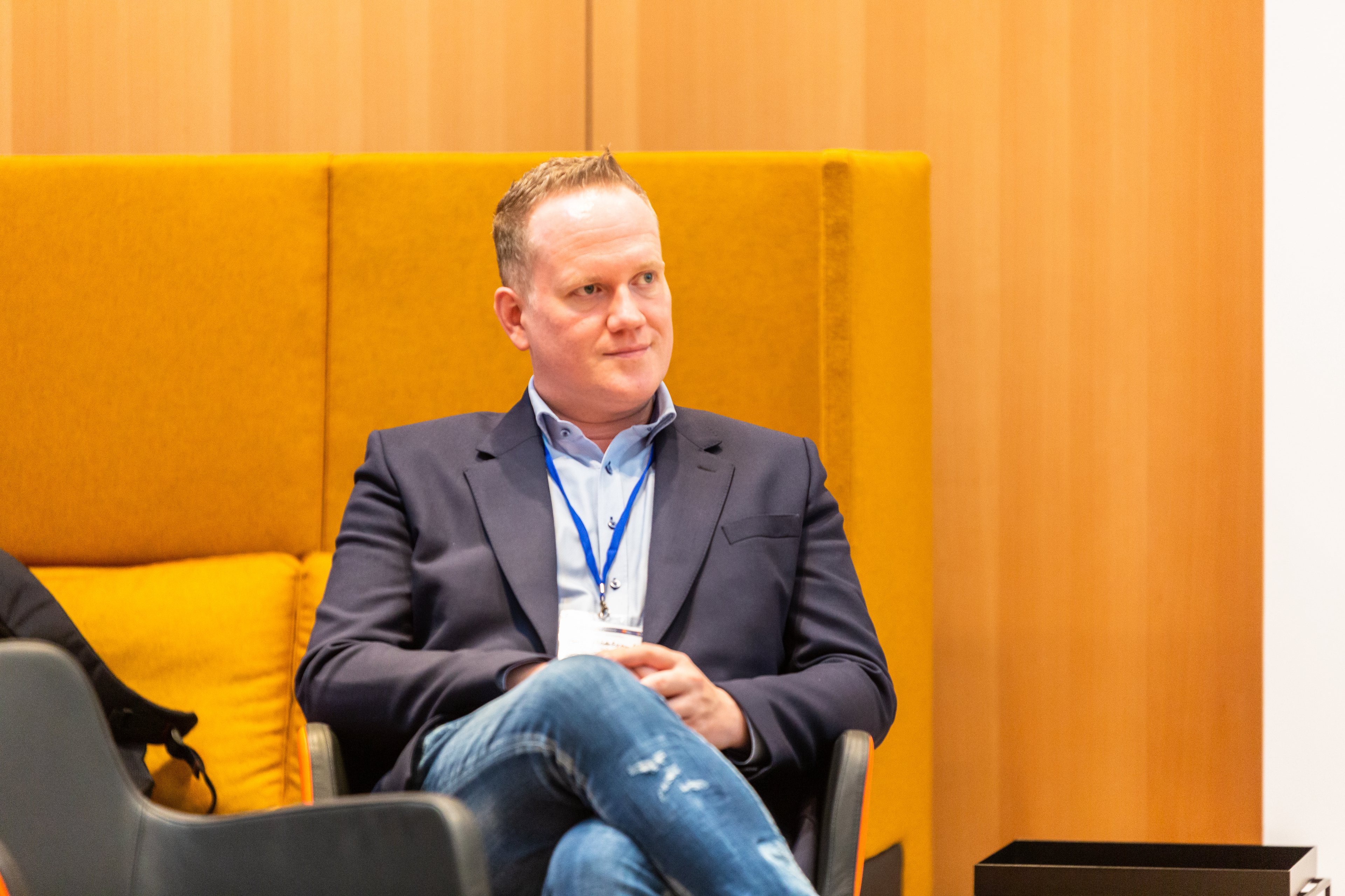 German Deep Tech Group founder Marc Hildebrandt listens intently at Softwareproduktion and Sustainability event